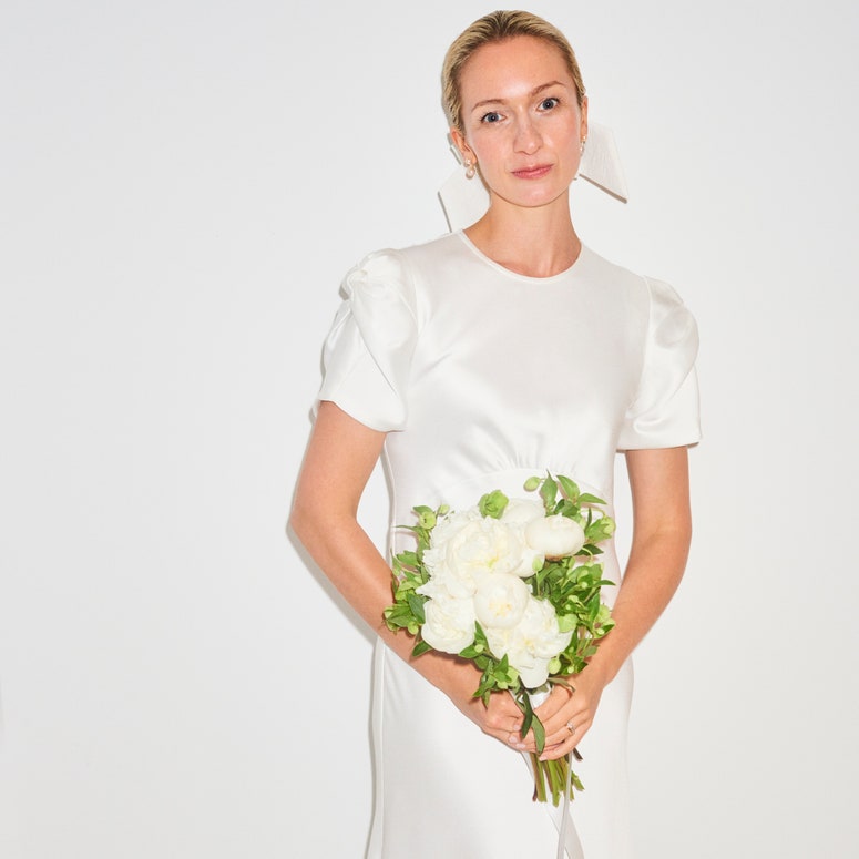 Image may contain: Clothing, Apparel, Human, Person, Plant, Flower, Blossom, Female, Flower Bouquet, and Flower Arrangement
